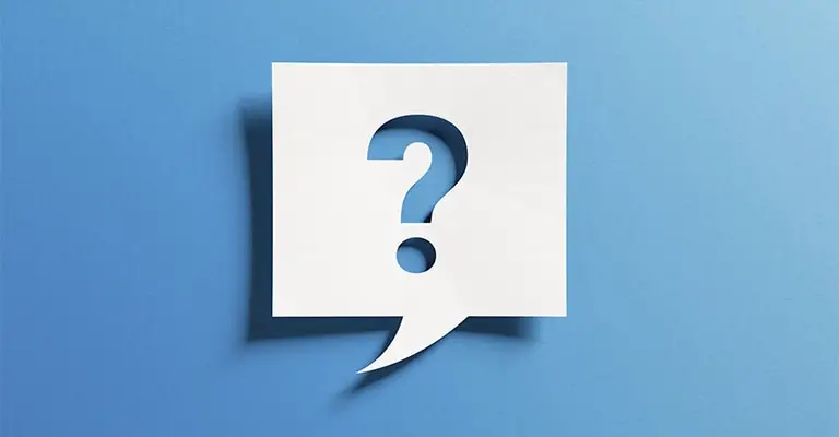 A white speech bubble cutout with a question mark in the center is set against a gradient blue background. The minimalist design suggests inquiry, curiosity, or an open conversation.