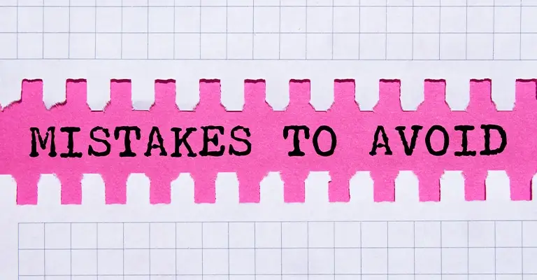 Text reading “MISTAKES TO AVOID” is revealed through a jagged, torn strip of pink paper against a grid-lined white background. The design emphasizes caution and highlights common pitfalls or errors to be aware of.