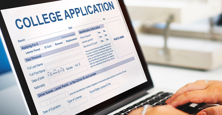 Hands typing on a laptop displaying a digital college application form, emphasizing the importance of accurate and polished personal information.