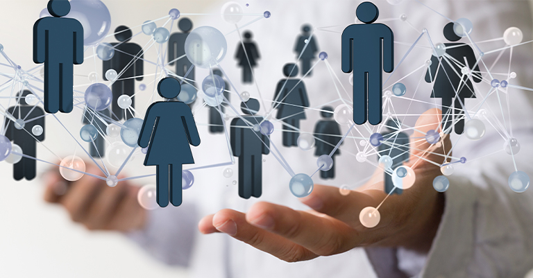 Person holding a digital web of connected people icons, representing social networking and human communication links.