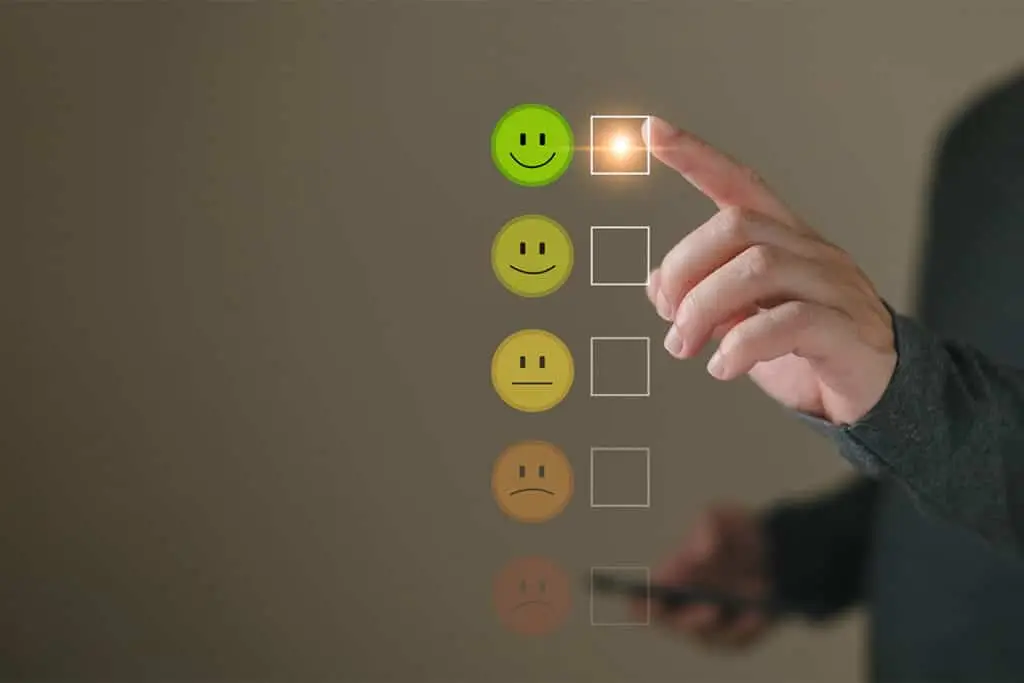 A hand selects the highest rating on a customer satisfaction scale, tapping a green smiley face with a glowing checkbox. The image suggests feedback collection used to build a positive professional online reputation.