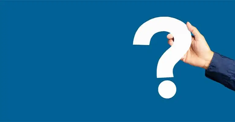 A hand holds a large white question mark against a solid blue background. The visual can introduce frequently asked questions about how to protect your online reputation.