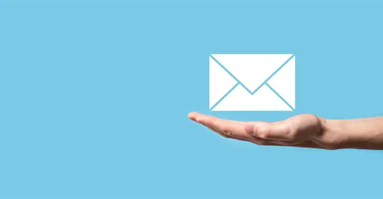 An open hand extends from the right side of a blue background with a simple white envelope icon floating above the palm. The visual suggests email outreach or direct messaging as a way to build your brand on LinkedIn.