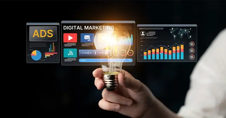 A hand holds a glowing light bulb in front of floating digital dashboard panels with charts video icons and analytics. The panels include the text “ADS” “DIGITAL MARKETING” and “WWW.”. This fits a personal branding for students article about using online tools to share skills and build visibility.