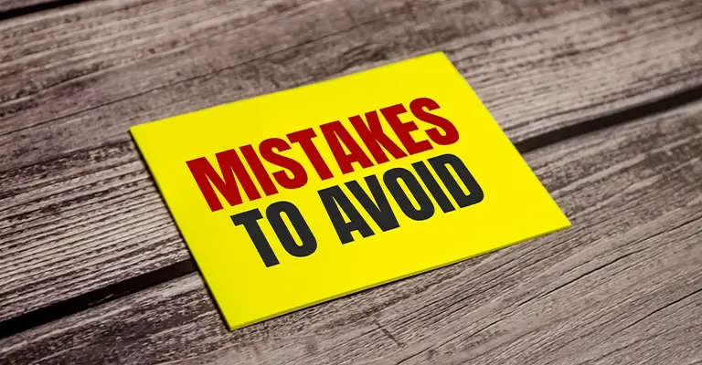 Yellow note on a rustic wooden table reads “MISTAKES TO AVOID.” The bold warning style introduces common personal branding errors to watch for.
