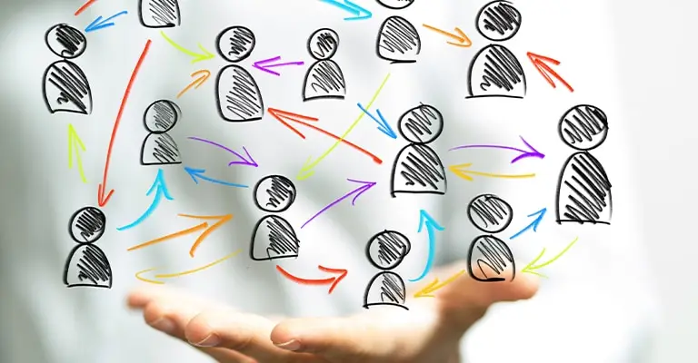 Open hands support a network of sketched people connected by colorful arrows moving in multiple directions. The busy flow of communication represents how relationships and engagement can help optimize your social media.